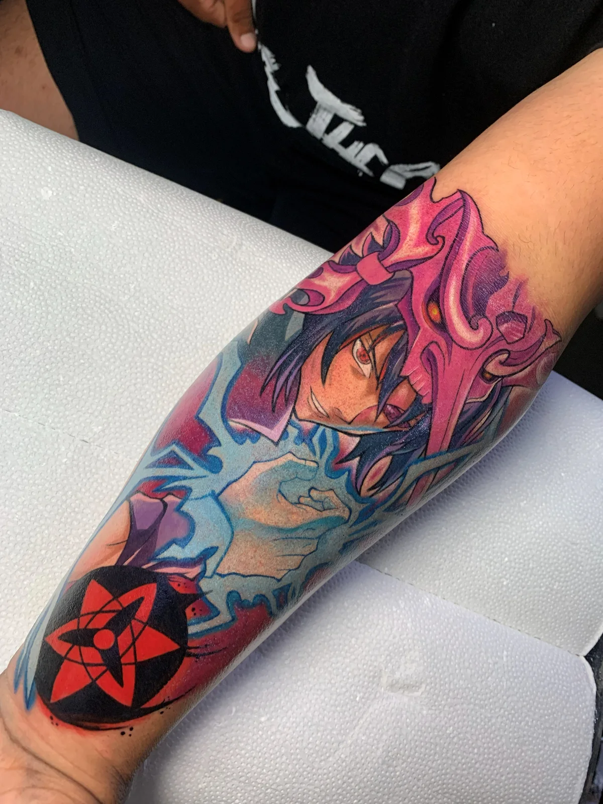 Colorful Naruto tattoo on the forearm